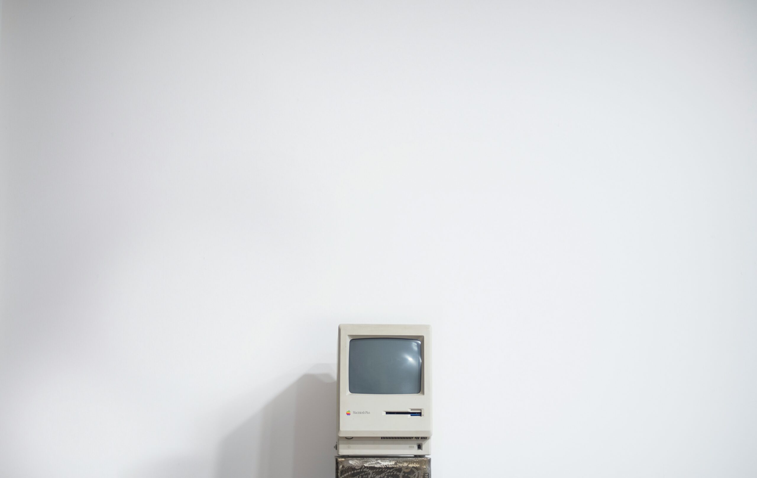 An old Macintosh computer against a white backdrop.