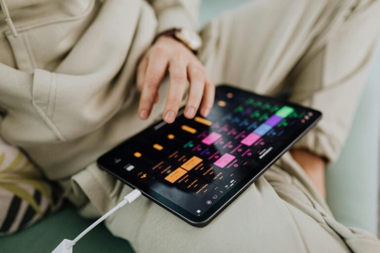 Hand tapping tablet screen for touch latency troubleshooting